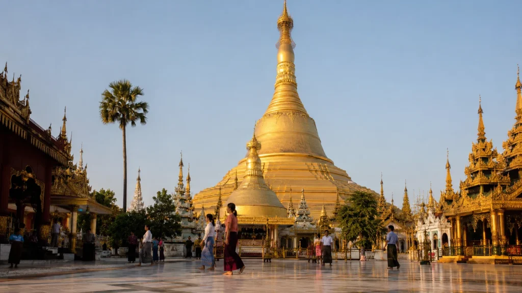 Visitors walking through the grounds of Shwemawdaw Pagoda in Bago, Myanmar